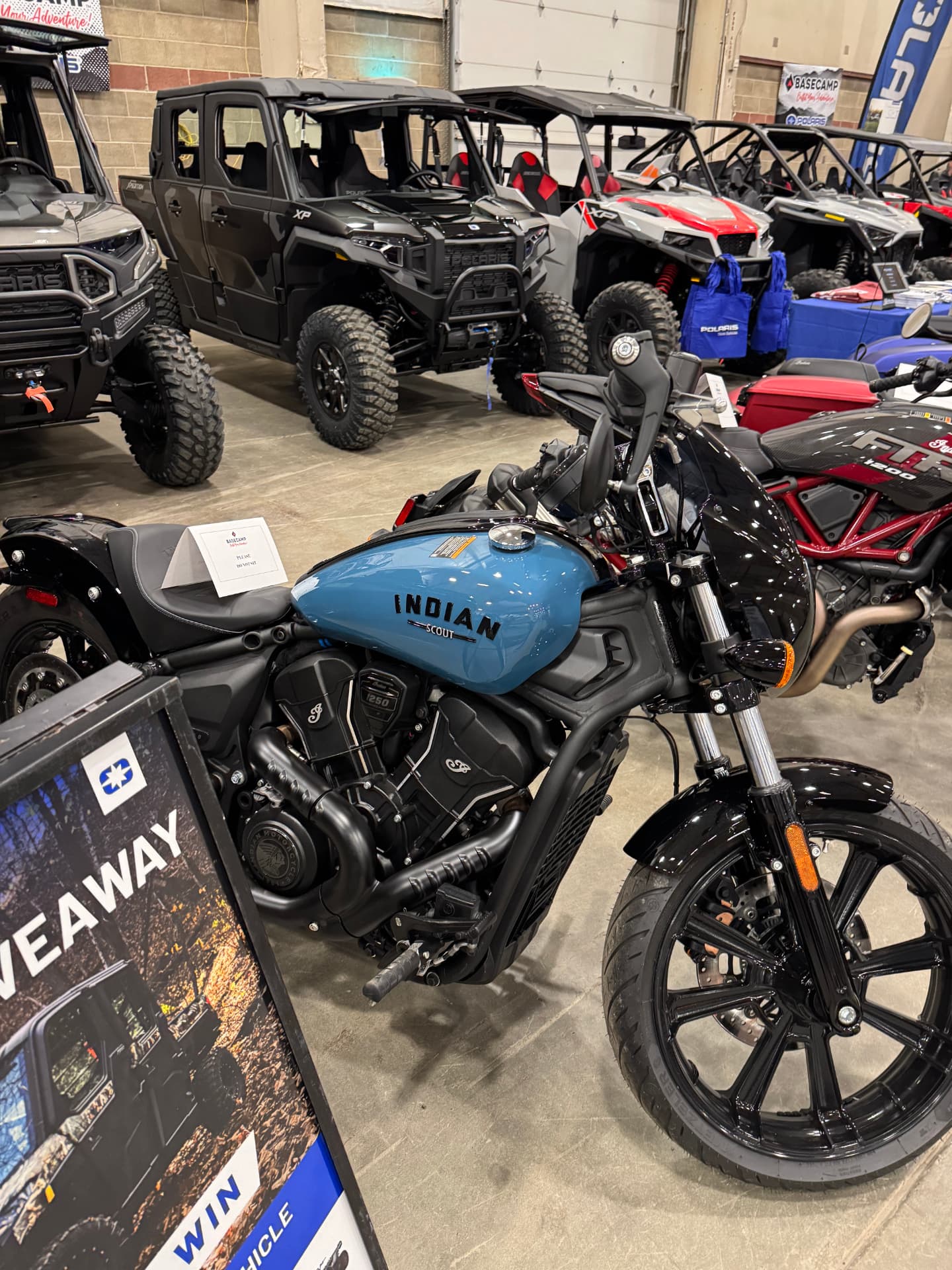 Powersports dealership floor with motorcycles and UTVs
